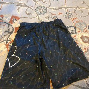 Under Armour black shorts with specks of color, size YLG